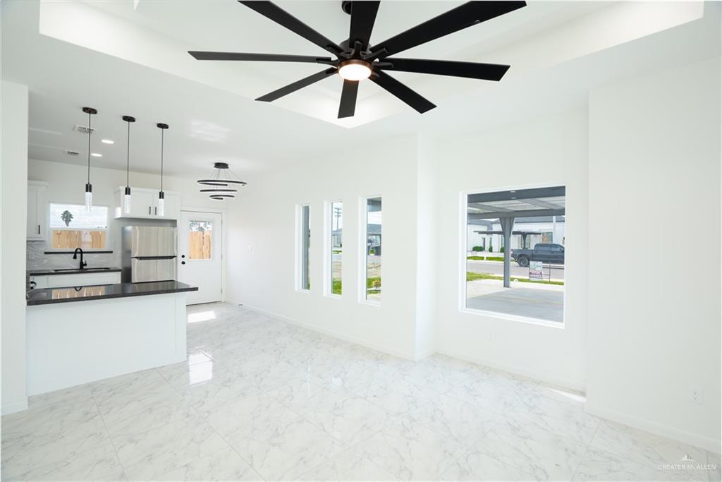 1408 South Xanthia Street, Unit 1 Alton, TX 78573 - Photo 6 of 19 a view of a kitchen with wooden floor and a window