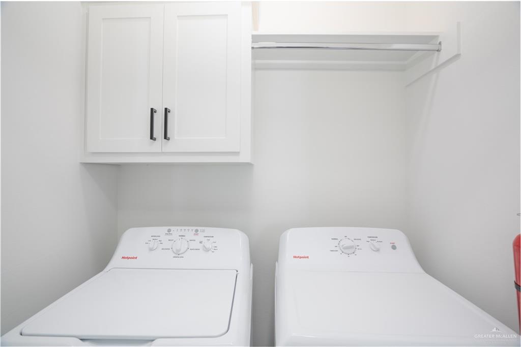 1408 South Xanthia Street, Unit 1 Alton, TX 78573 - Photo 10 of 19 a utility room with dryer and washer