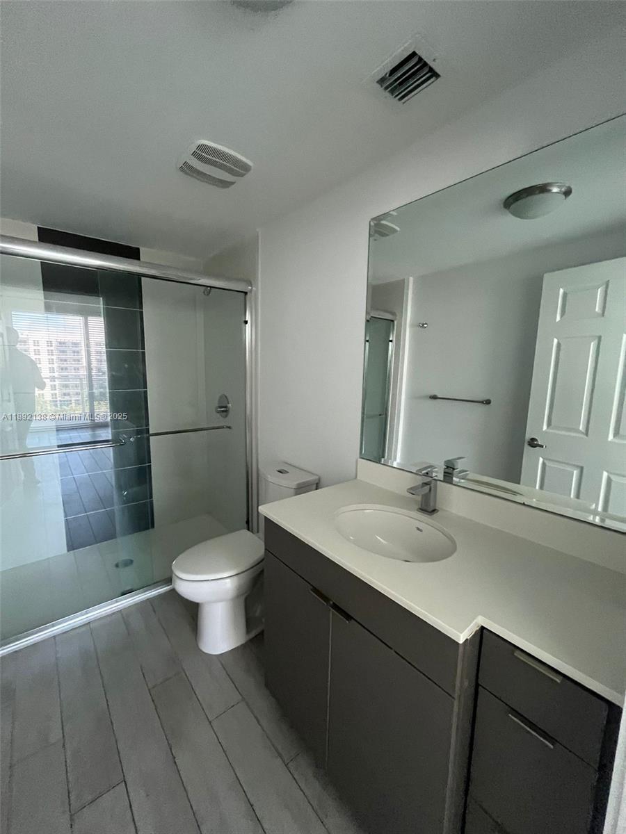 321 Northeast 26th Street, Unit 717 Miami, FL 33137 - Photo 17 of 27 a bathroom with a sink toilet and shower
