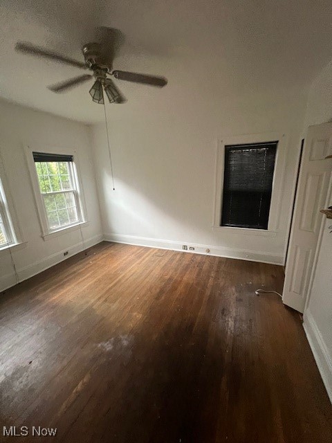 2915 Ludlow Road Cleveland, OH 44120 - Photo 50 of 50 Unfurnished room featuring dark wood-style flooring, ceiling fan, and heating unit