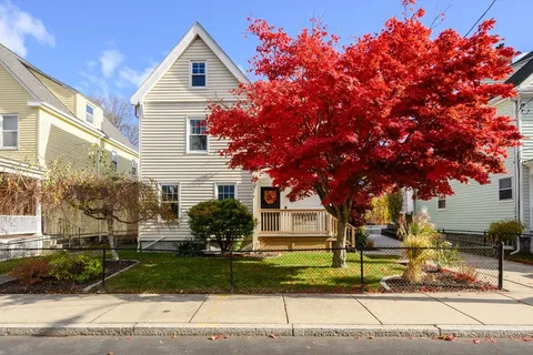 a front view of a house with garden