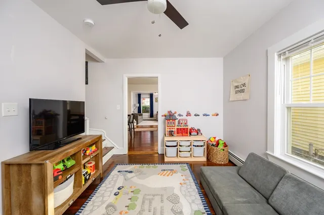a bed room with furniture and a flat screen tv