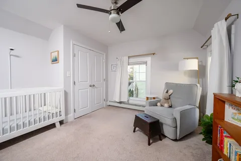 a bed room with furniture and a window