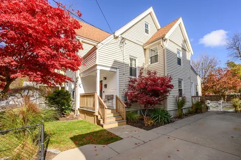 a front view of a house with garden