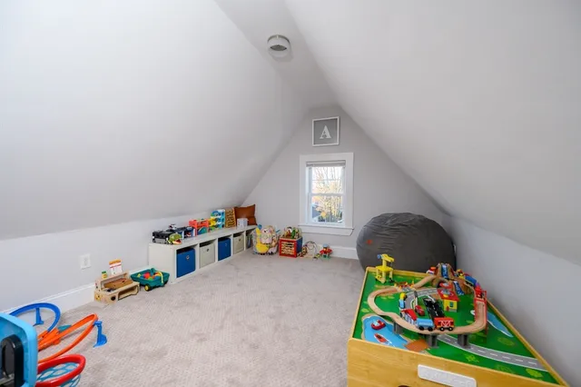 a view of play room with toys and children play ground
