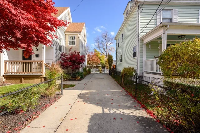 a view of a house with a yard