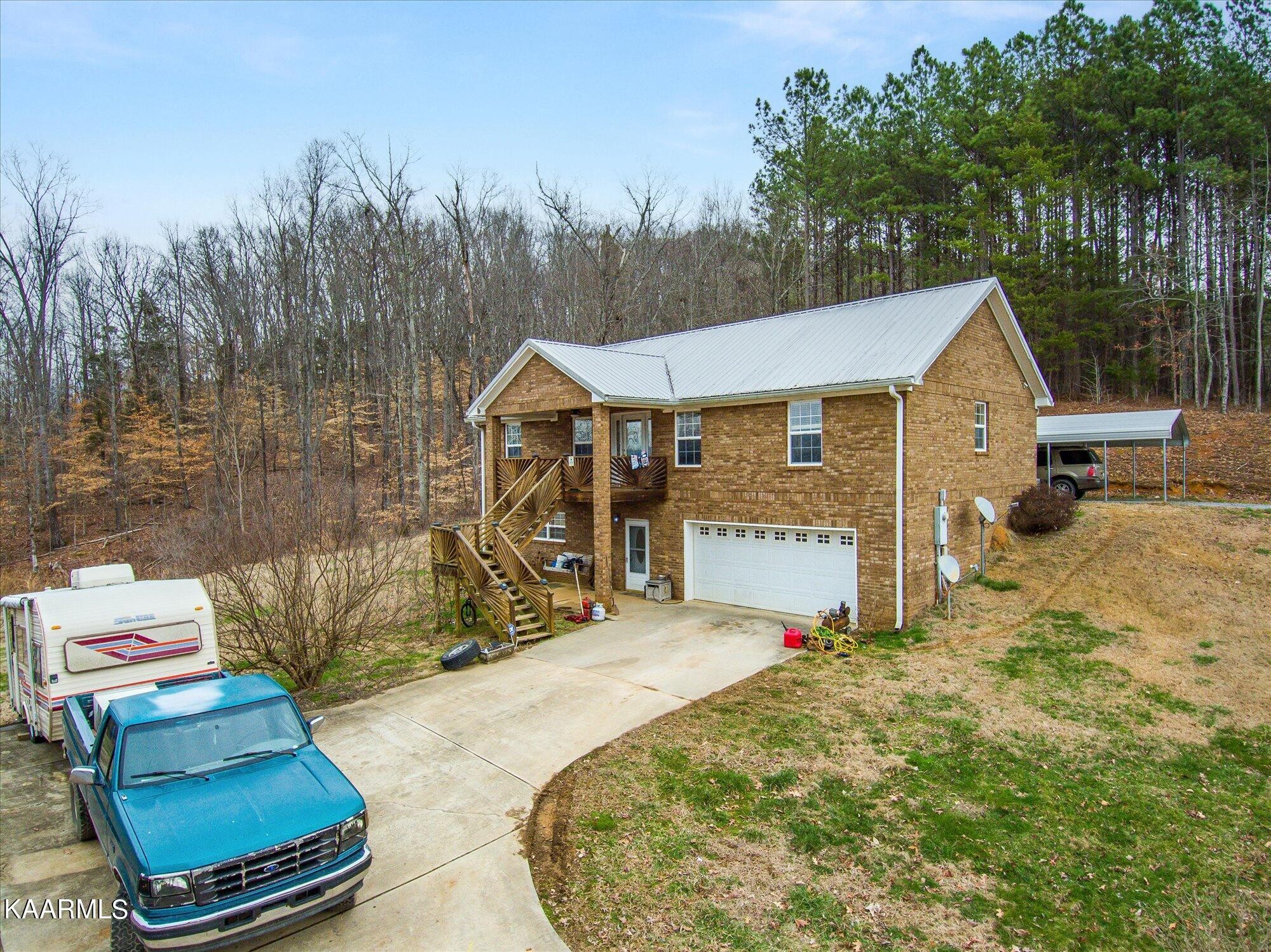 1190 Wilson Hollow Road Decatur, TN 37322 - Photo 1 of 36 a view of a house with backyard and sitting area