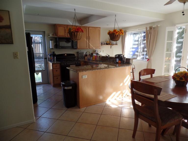 1310 Meadowbrook Road Ojai, CA 93023 - Photo 4 of 14 a kitchen with a sink a stove and refrigerator