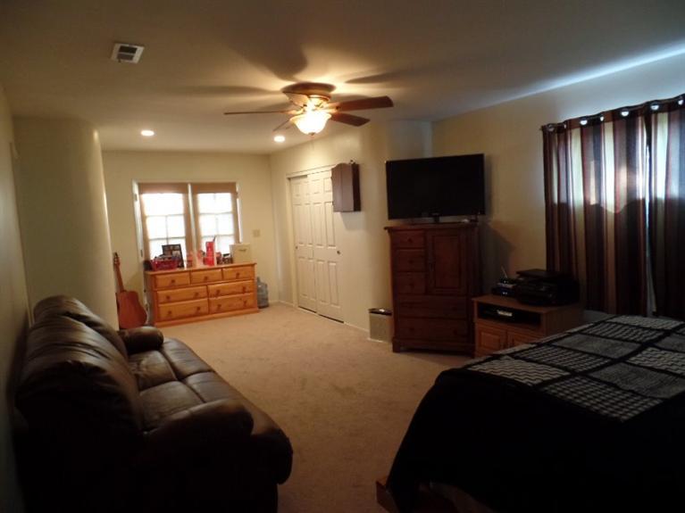 1310 Meadowbrook Road Ojai, CA 93023 - Photo 8 of 14 a bedroom with a bed and a flat screen tv