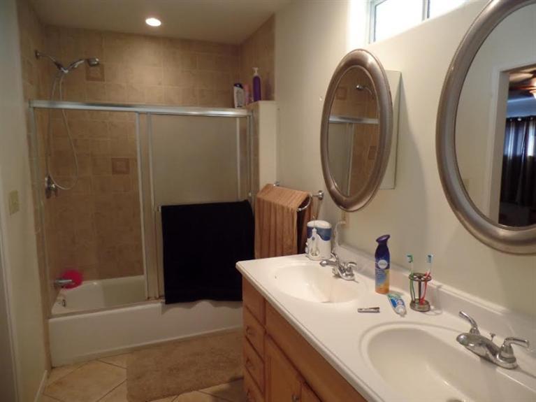 1310 Meadowbrook Road Ojai, CA 93023 - Photo 9 of 14 a bathroom with a sink a toilet and shower