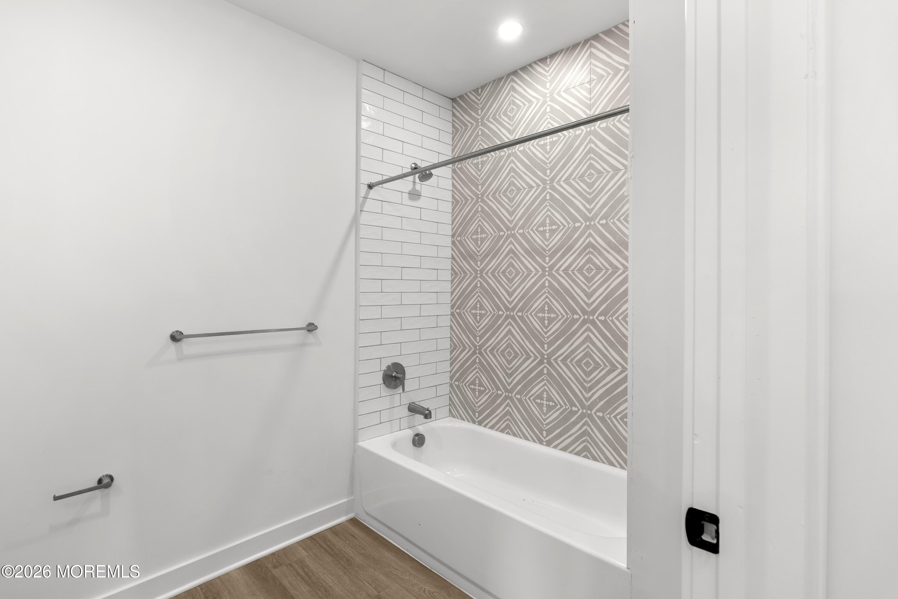 180 Morris Avenue, Unit 101 Long Branch, NJ 07740 - Photo 8 of 9 a bathroom with a bathtub and a shower