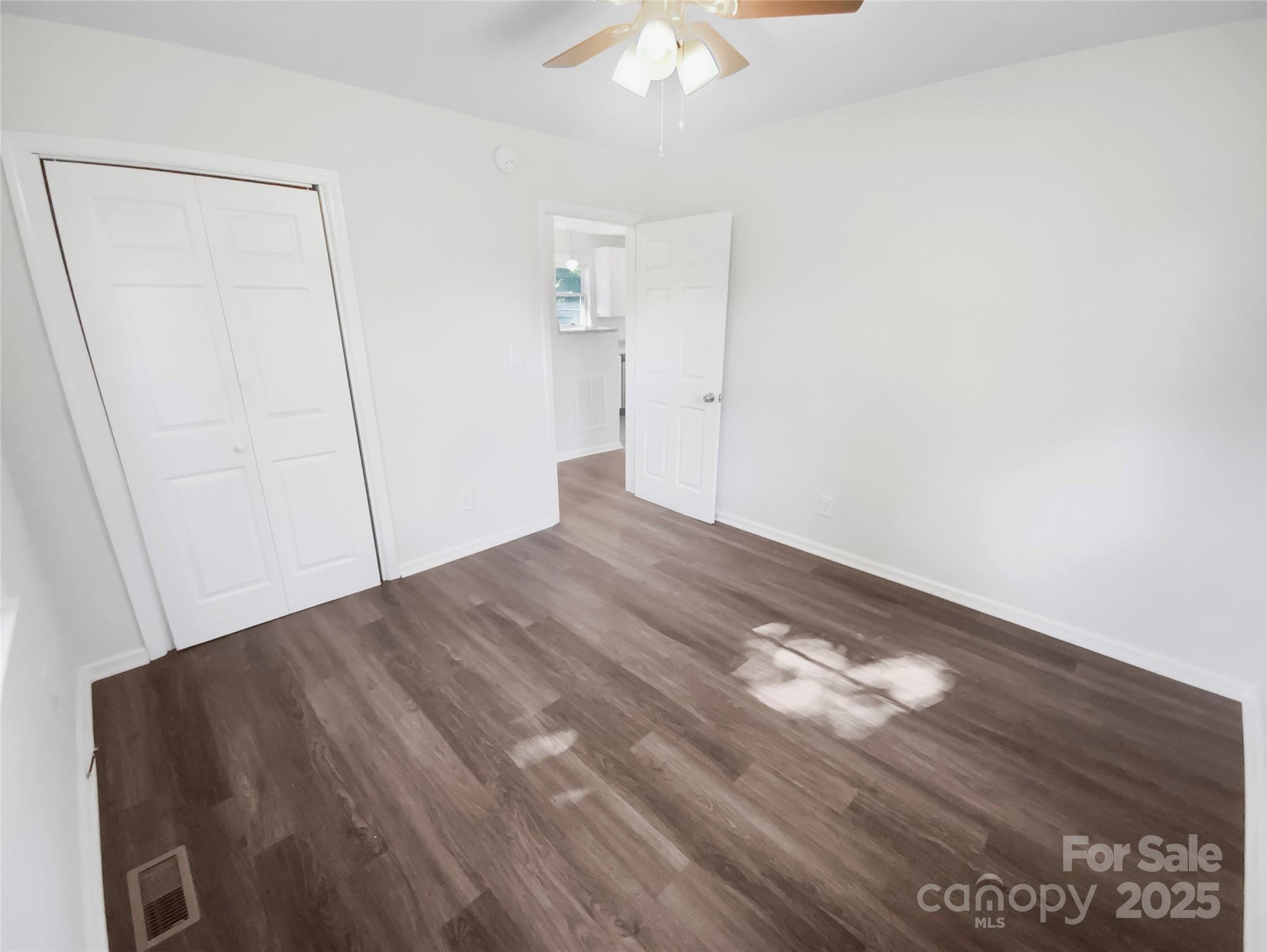 349 Wakefield Drive, Unit A Charlotte, NC 28209 - Photo 17 of 20 a view of empty room with wooden floor