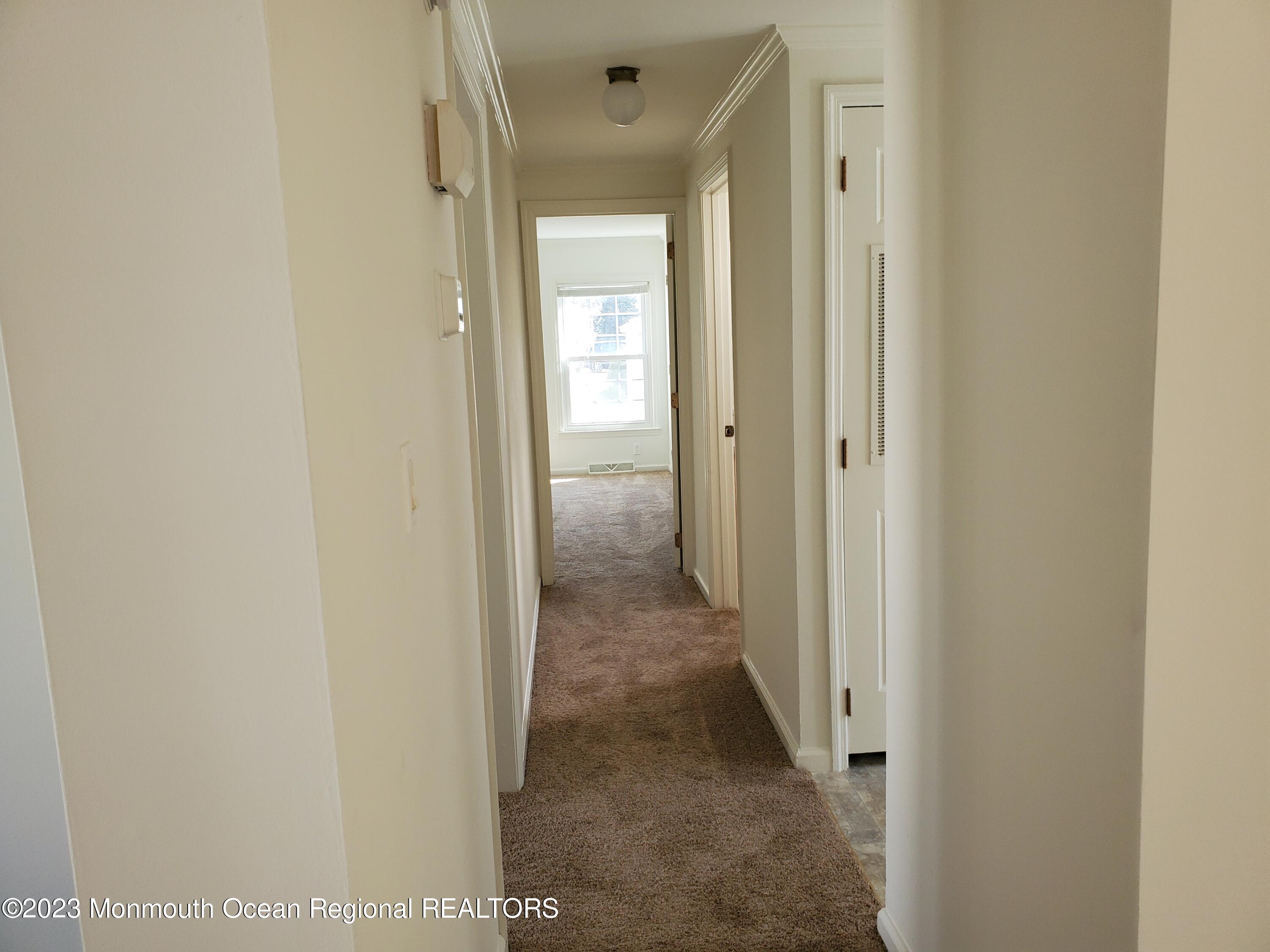 29 Pine Ridge Boulevard Whiting, NJ 08759 - Photo 12 of 29 a view of a hallway with a wooden door