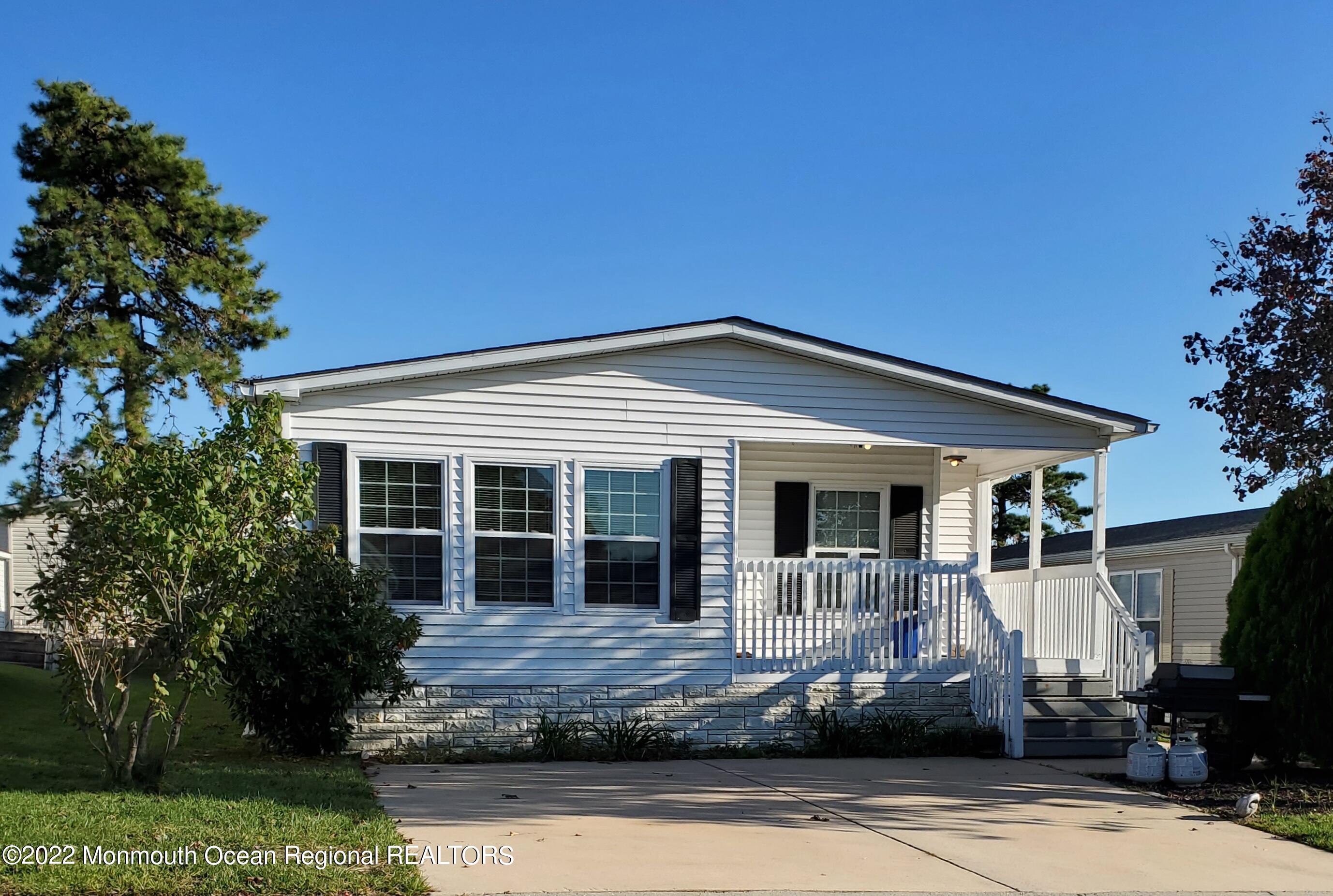29 Pine Ridge Boulevard Whiting, NJ 08759 - Photo 2 of 29 a front view of a house with porch