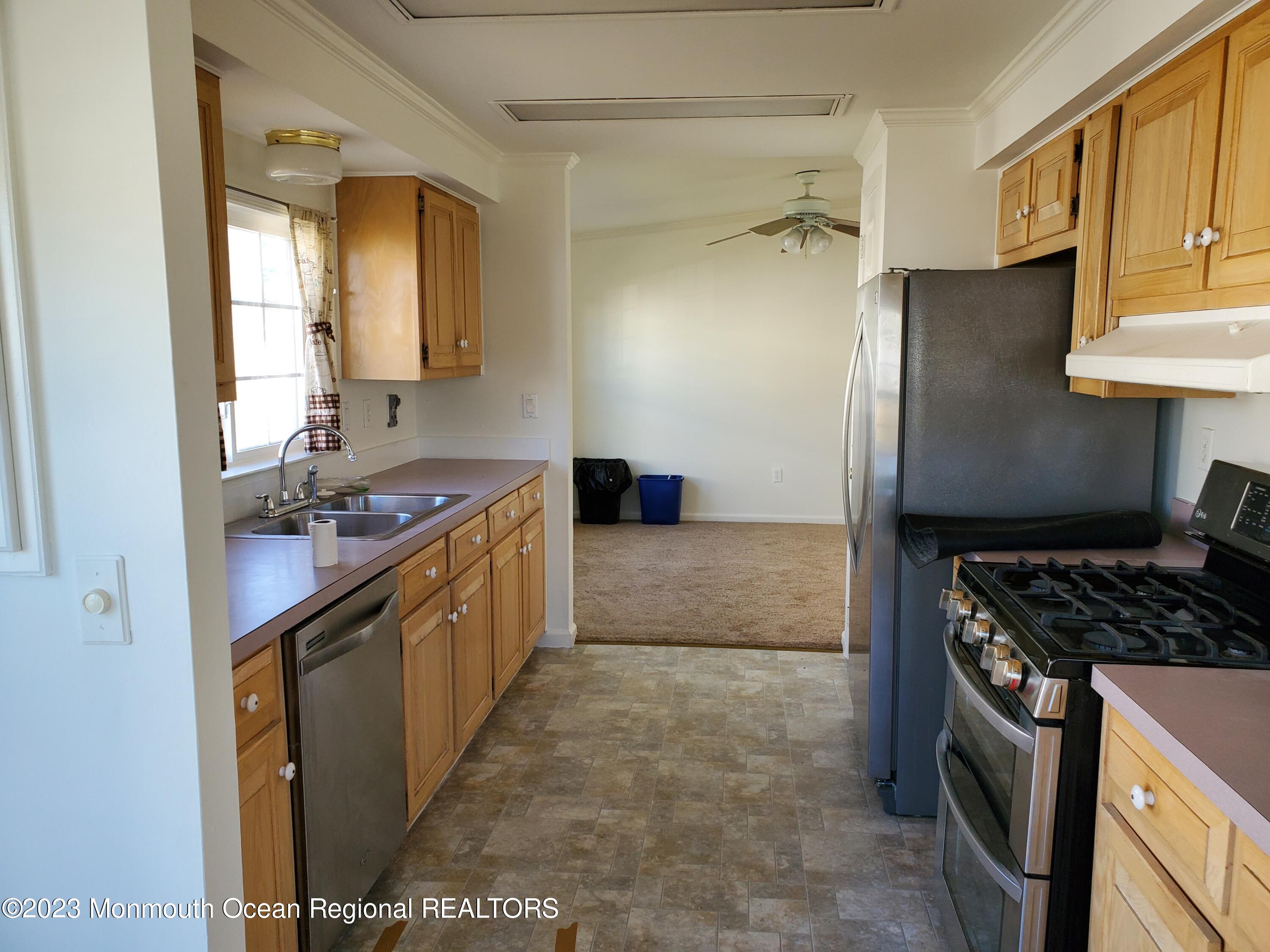 29 Pine Ridge Boulevard Whiting, NJ 08759 - Photo 9 of 29 a kitchen with a sink stove and refrigerator