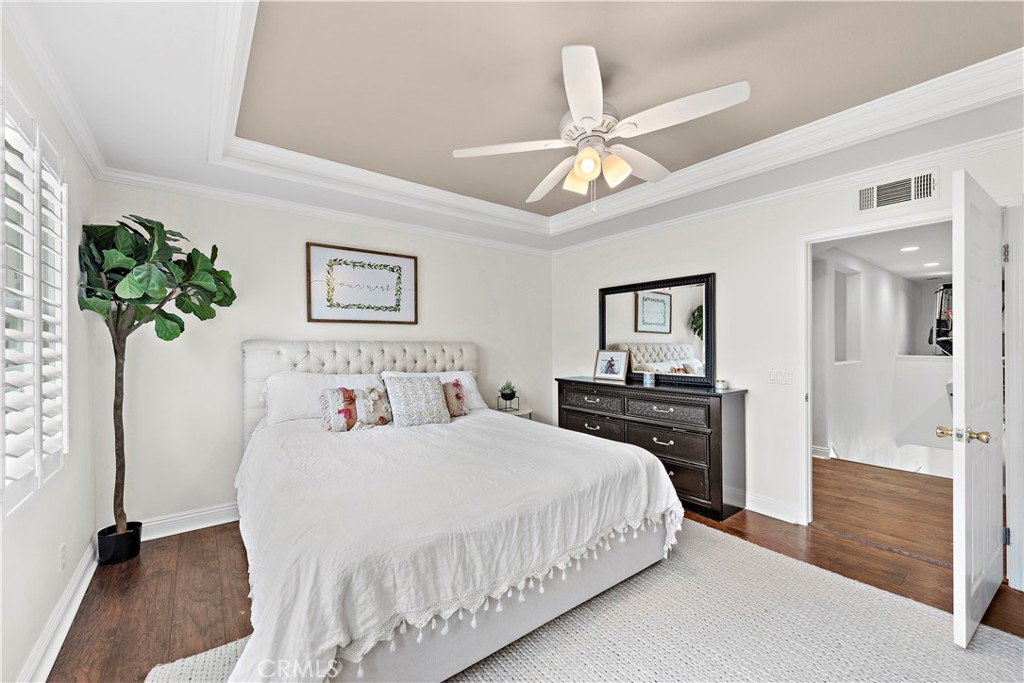 14 Celestine Circle Ladera Ranch, CA 92694 - Photo 18 of 42 a bedroom with a bed and a chandelier