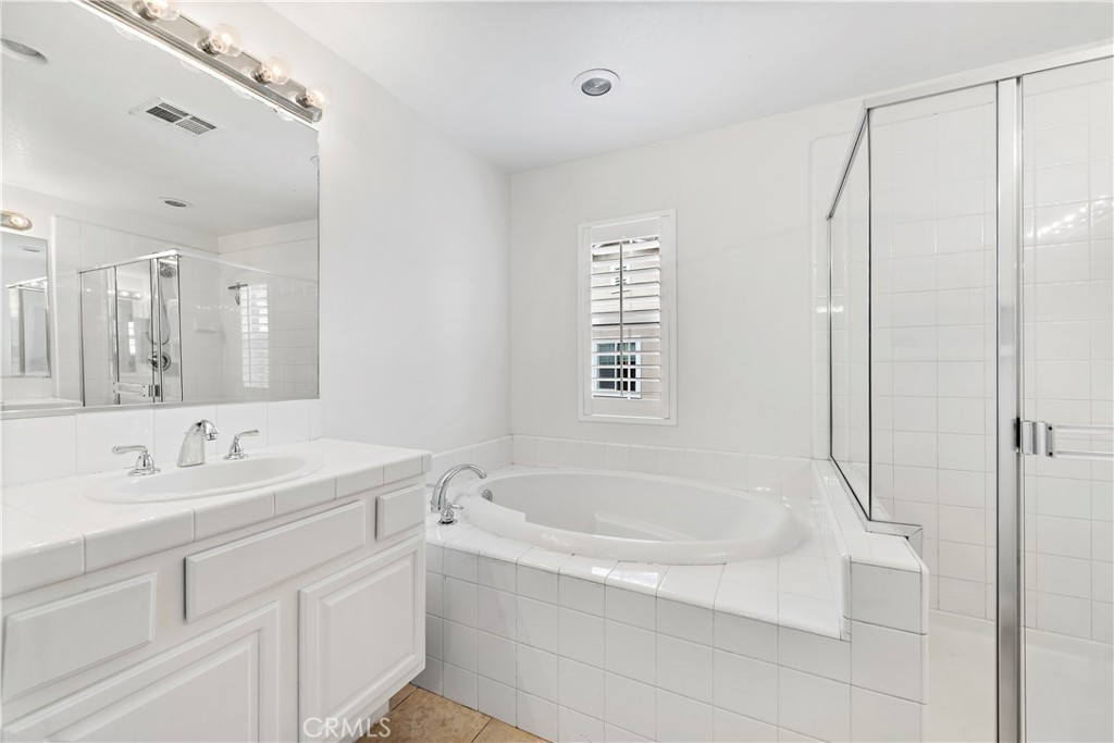 14 Celestine Circle Ladera Ranch, CA 92694 - Photo 20 of 42 a white bath tub sitting next to a white sink