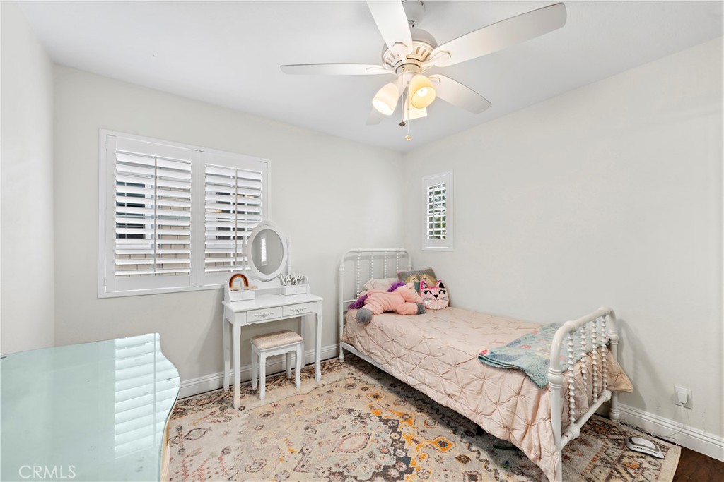 14 Celestine Circle Ladera Ranch, CA 92694 - Photo 23 of 42 a bedroom with a bed and a chandelier