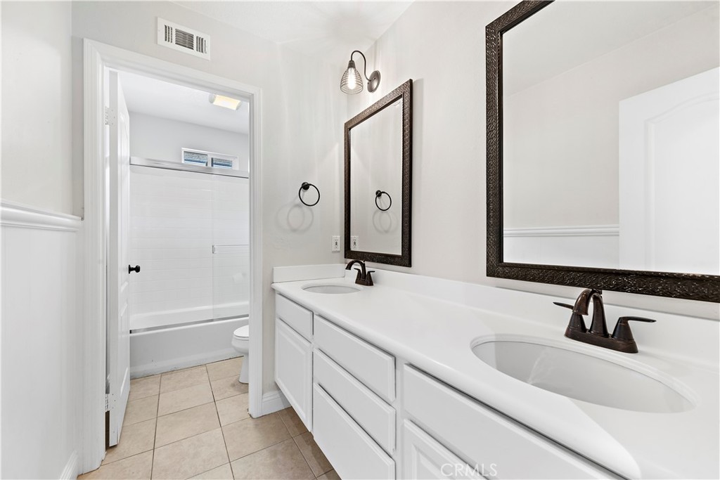 14 Celestine Circle Ladera Ranch, CA 92694 - Photo 24 of 42 a bathroom with a sink and a mirror