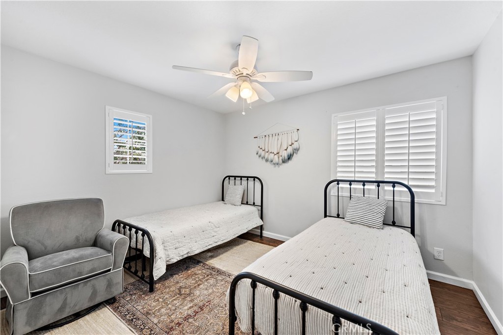 14 Celestine Circle Ladera Ranch, CA 92694 - Photo 25 of 42 a bedroom with two beds and a chandelier