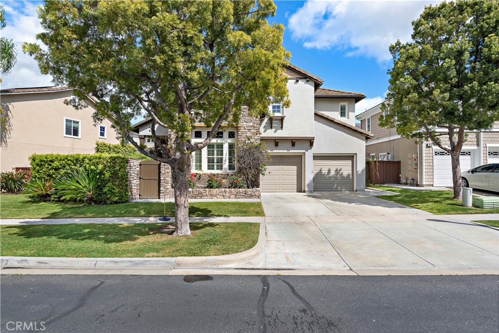 14 Celestine Circle Ladera Ranch, CA 92694 - Photo 26 of 42 a front view of a house with a yard and garage