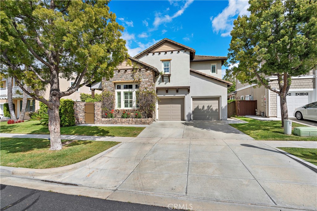 14 Celestine Circle Ladera Ranch, CA 92694 - Photo 28 of 42 a front view of a house with a yard and garage