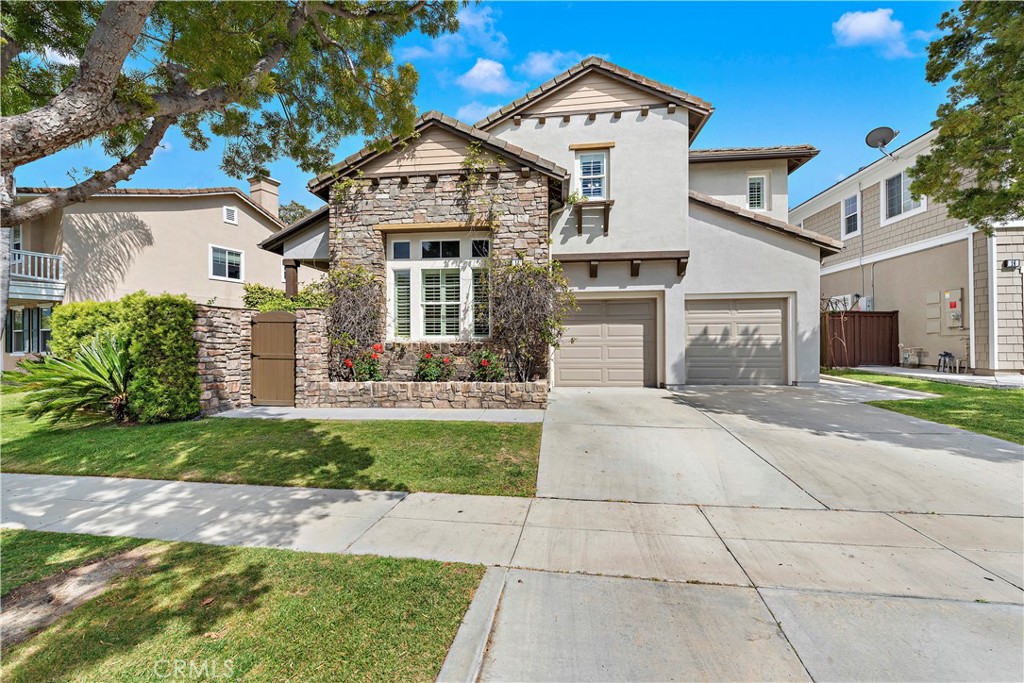 14 Celestine Circle Ladera Ranch, CA 92694 - Photo 31 of 42 a front view of a house with a yard and potted plants