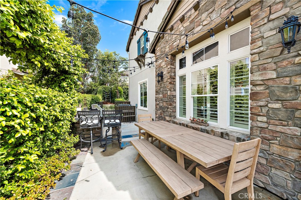 14 Celestine Circle Ladera Ranch, CA 92694 - Photo 34 of 42 a view of a patio with table and chairs and potted plants