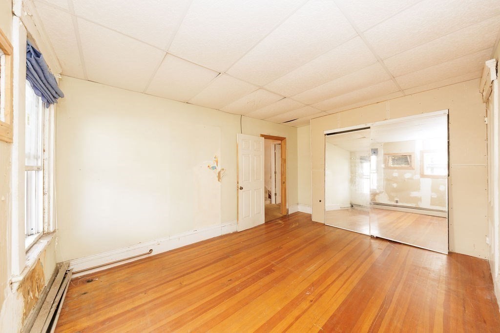 33 Russell Street Boston, MA 02129 - Photo 11 of 27 a big room with wooden floor and natural light
