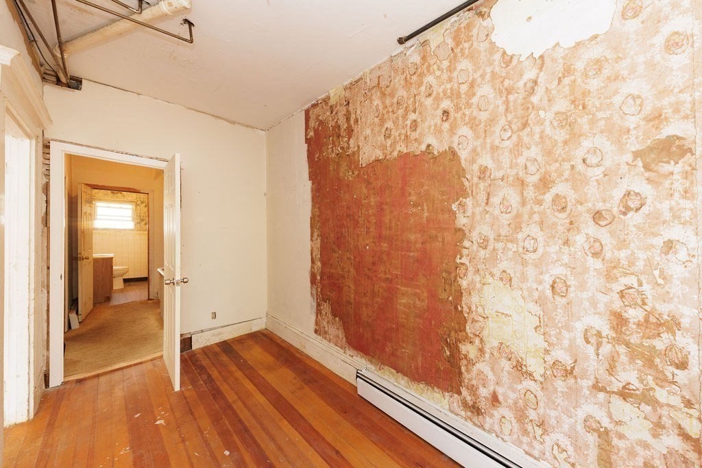 33 Russell Street Boston, MA 02129 - Photo 13 of 27 a view of a bathroom with wooden floor and a shower