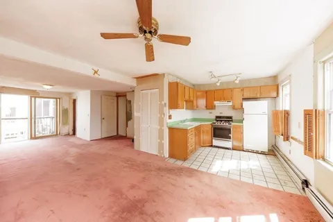 a view of a kitchen with a sink and a window