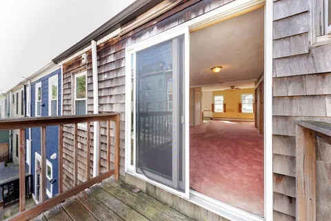 a view of an entryway with a balcony
