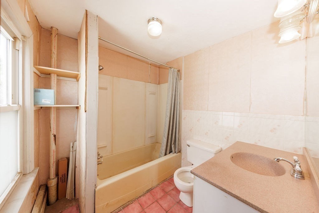 33 Russell Street Boston, MA 02129 - Photo 21 of 27 a bathroom with a sink a toilet and shower