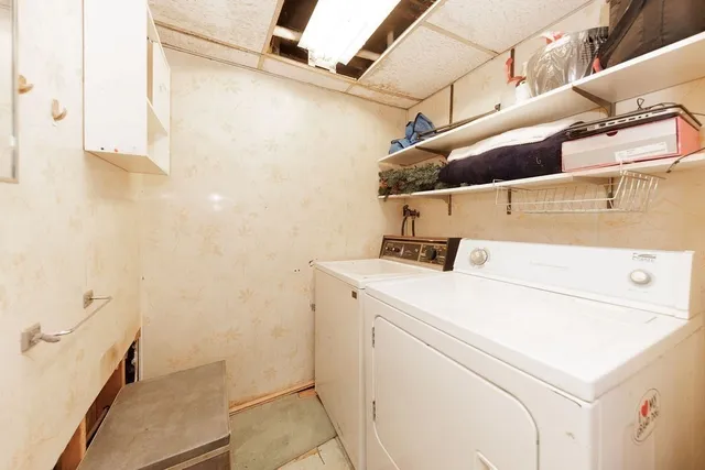 a utility room with dryer and washer