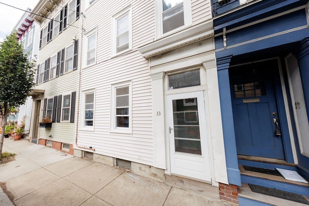 33 Russell Street Boston, MA 02129 - Photo 26 of 27 a view of a house with a door and a window