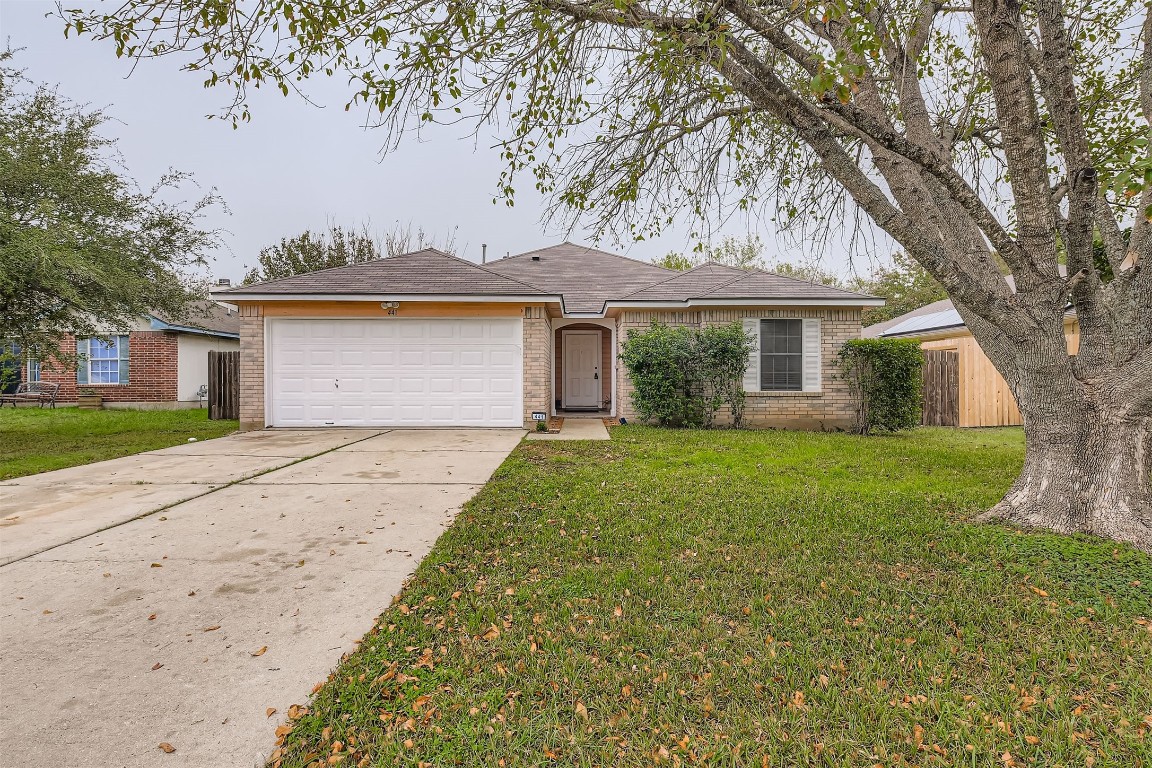 441 Keystone Loop Kyle, TX 78640 - Photo 1 of 17 a front view of a house with a garden