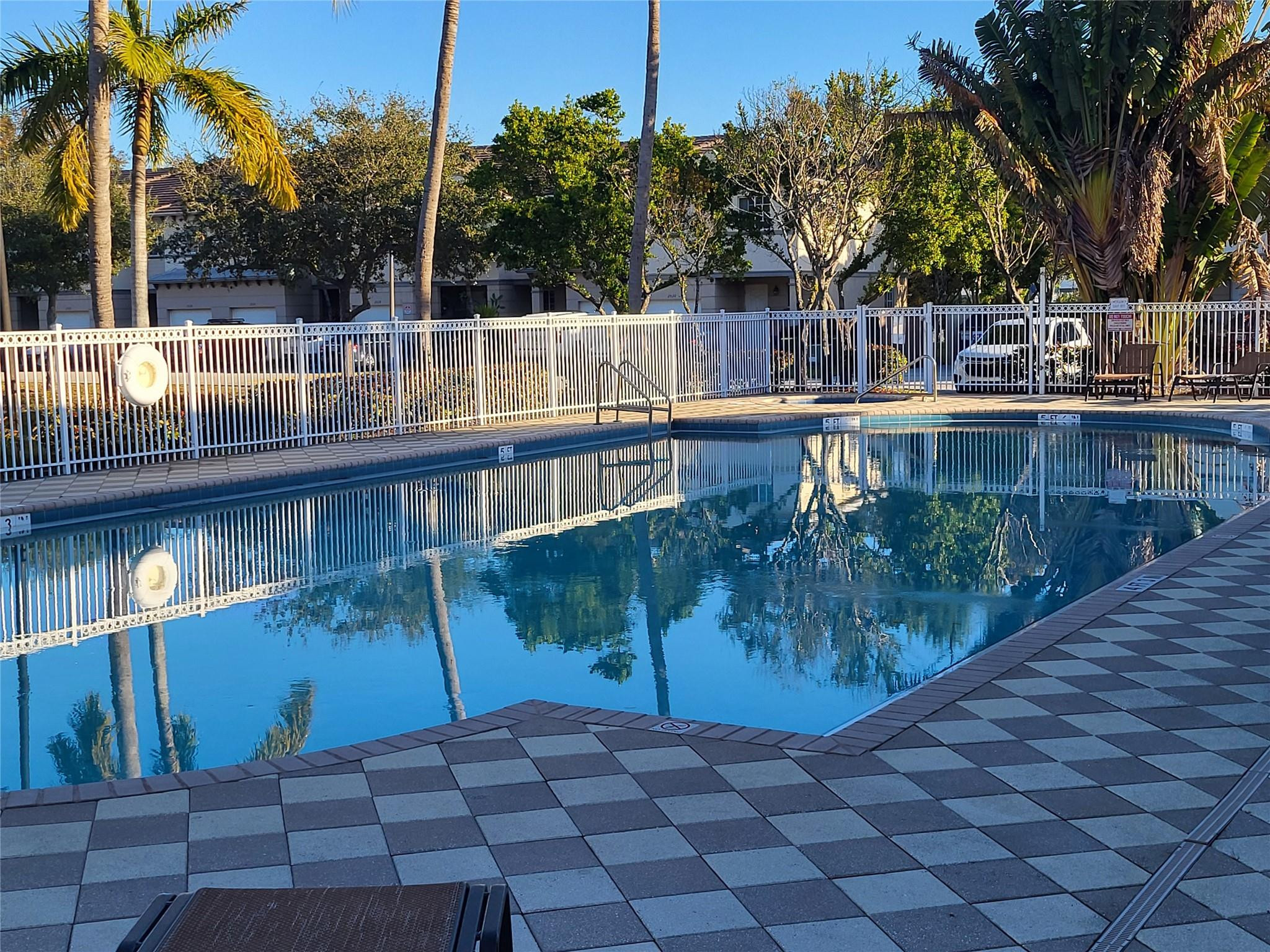 1957 Freeport Drive, Unit 1957 Riviera Beach, FL 33404 - Photo 12 of 14 a view of swimming pool with a patio