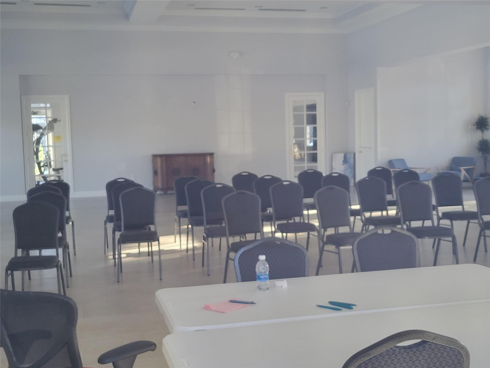 1957 Freeport Drive, Unit 1957 Riviera Beach, FL 33404 - Photo 13 of 14 a living room with furniture and chandelier