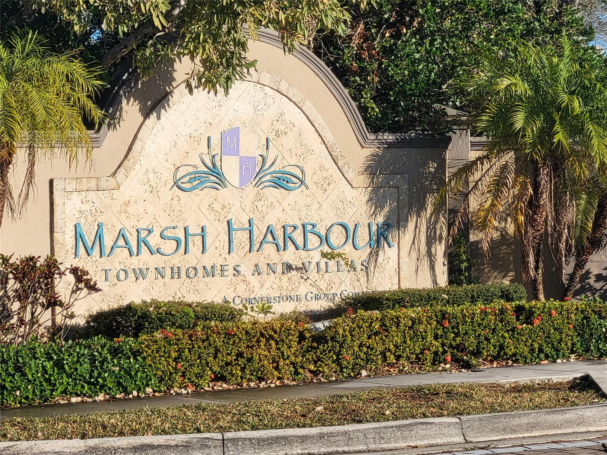 1957 Freeport Drive, Unit 1957 Riviera Beach, FL 33404 - Photo 14 of 14 a sign that is on the side of the road