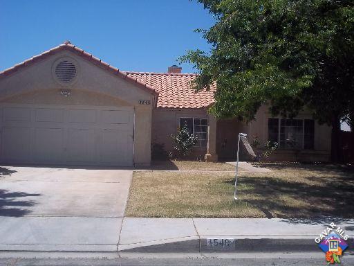 1546 Kings Road Palmdale, CA 93551 - Photo 1 of 7 a front view of a house with a yard