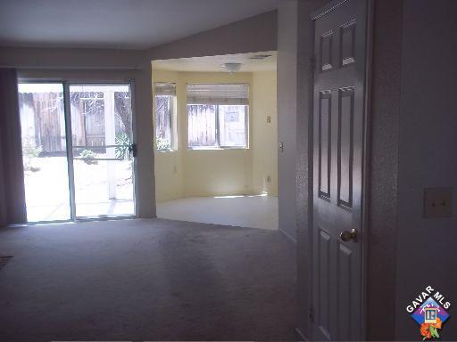 1546 Kings Road Palmdale, CA 93551 - Photo 3 of 7 a view of an empty room with a window