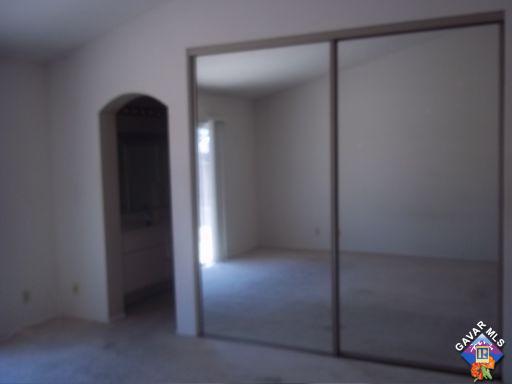 1546 Kings Road Palmdale, CA 93551 - Photo 6 of 7 a view of entryway with a hallway