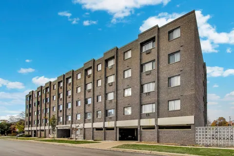 a view of a building with a street