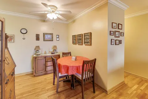 a view of a dining room with furniture and chandelier