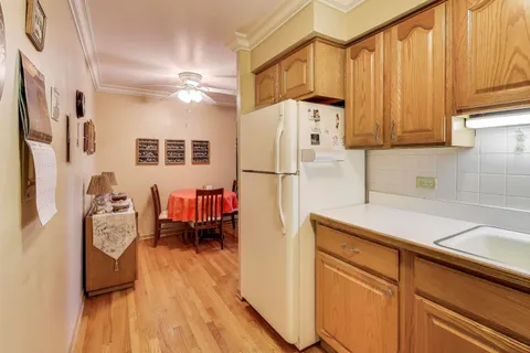 a kitchen with stainless steel appliances a refrigerator and a sink