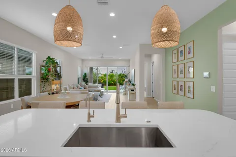a bathroom with a granite countertop sink a toilet and a shower