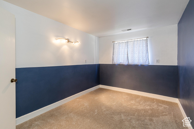 167 East 100 North, Unit B Logan, UT 84321 - Photo 13 of 18 Carpeted empty room featuring baseboards