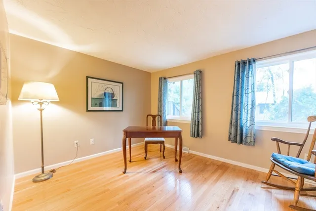 a bedroom with a bed and a table in it