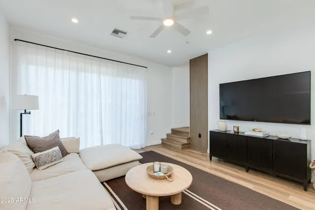 a kitchen with stainless steel appliances a stove a sink a microwave and cabinets