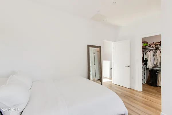 a bedroom with a washer and dryer